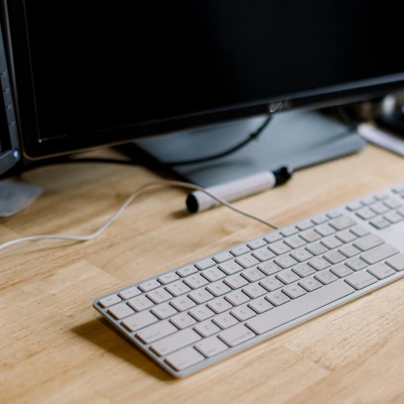 Young IT specialists works on computers in office